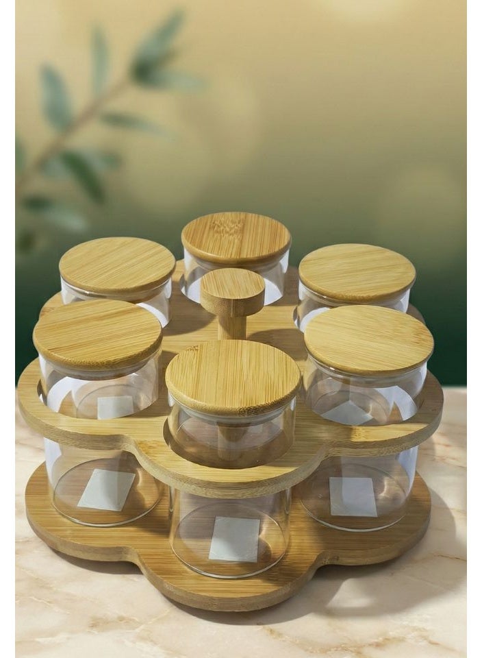 طقم توابل من Casa Home مصنوع من زجاج وبسعة 250 مل مع أغطية بامبو ويأتي مع ستاند للتنظيم.